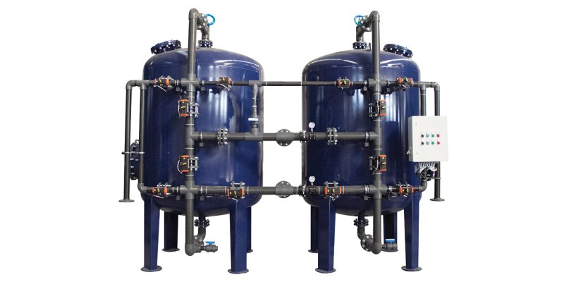 TANDEM SOFTENING SYSTEMS WITH STEEL TANK SURFACE PIPING